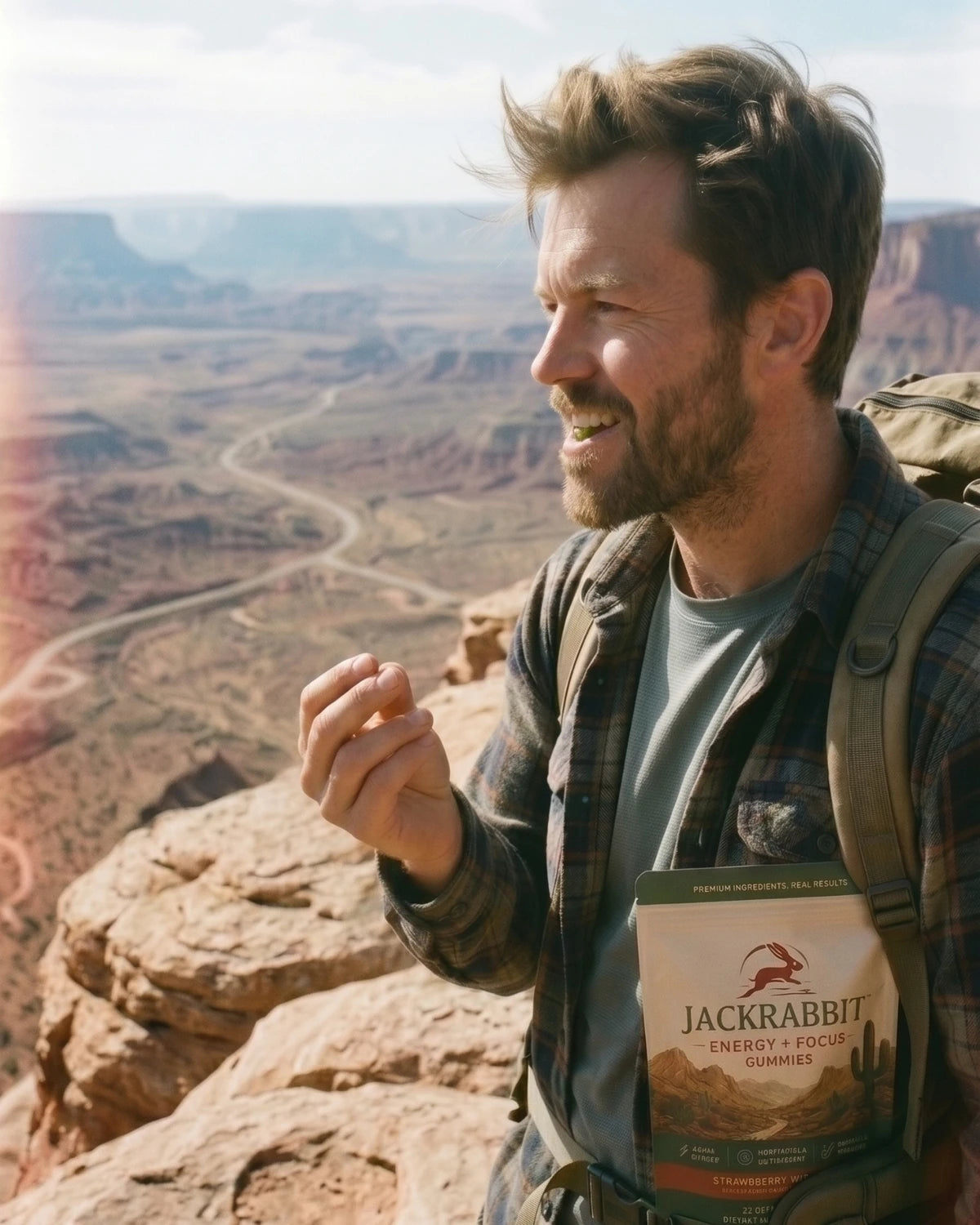Hiker carrying Jackrabbit gummies in a canyon